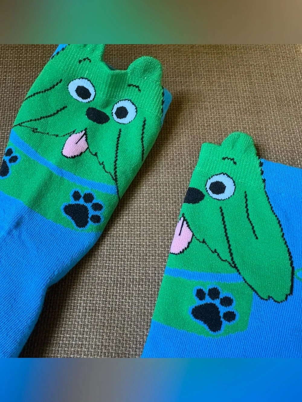 Blue & green dog socks with green dog faces and black paw prints #doglovers #paw
